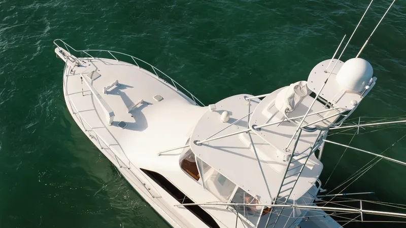 Slide: The Image of Aerial view of 2005 Viking 48 Convertible yacht on green water. - 38