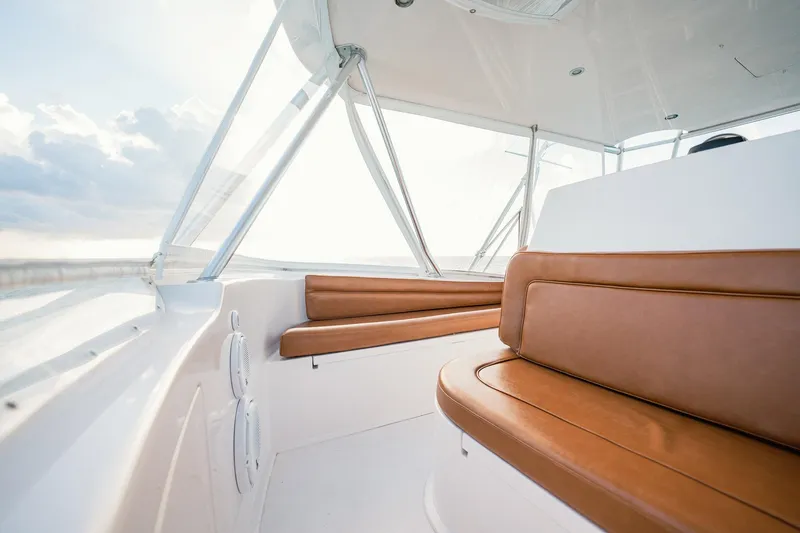 Slide: The Image of Interior of 2005 Viking 48 Convertible yacht with brown leather seating. - 42