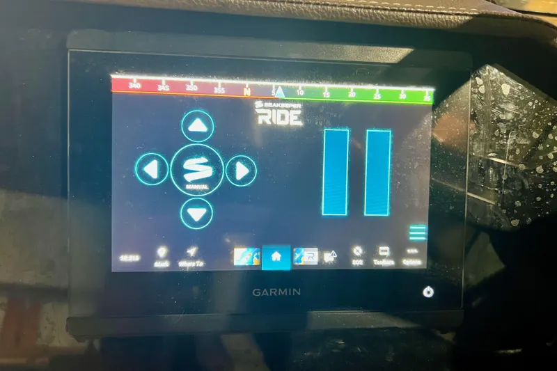 Slide: The Image of Garmin display on 2018 Sea Ray SLX 250 boat dashboard showing navigation controls. - 12