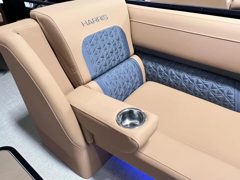 Slide: The Image of Luxurious seating on 2025 Harris Solstice 250 boat with quilted upholstery and cup holder. - 14