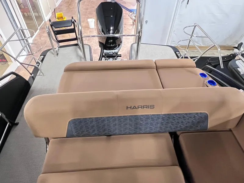 Slide: The Image of 2025 Harris Solstice 250 boat interior with tan seating and modern design. - 24