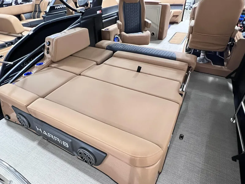 Slide: The Image of 2025 Harris Solstice 250 boat interior with tan seating and modern design. - 25