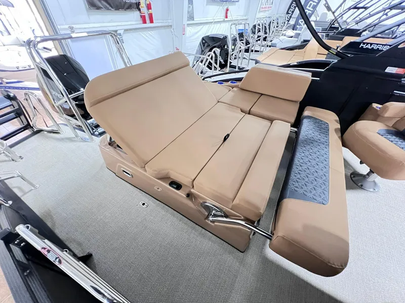 Slide: The Image of 2025 Harris Solstice 250 boat interior with tan seating and modern design. - 26
