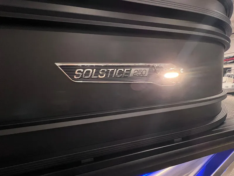 Slide: The Image of 2025 Harris Solstice 250 boat emblem with sleek design and lighting. - 29