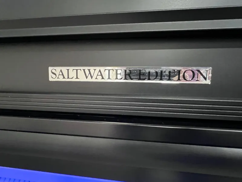 Slide: The Image of 2025 Harris Solstice 250 Saltwater Edition badge on black surface. - 31