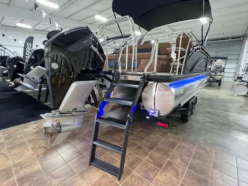 Slide: The Image of 2025 Harris Solstice 250 pontoon boat with outboard motor in showroom. - 34