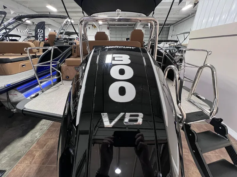 Slide: The Image of 2025 Harris Solstice 250 boat with Mercury 300 V8 engine in showroom. - 38