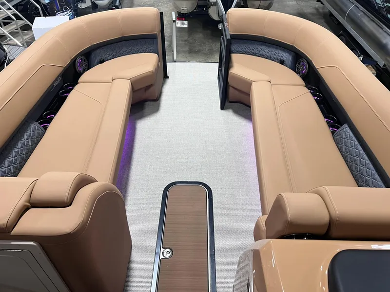 Slide: The Image of 2025 Harris Solstice 250 boat interior with tan seating and modern design. - 6