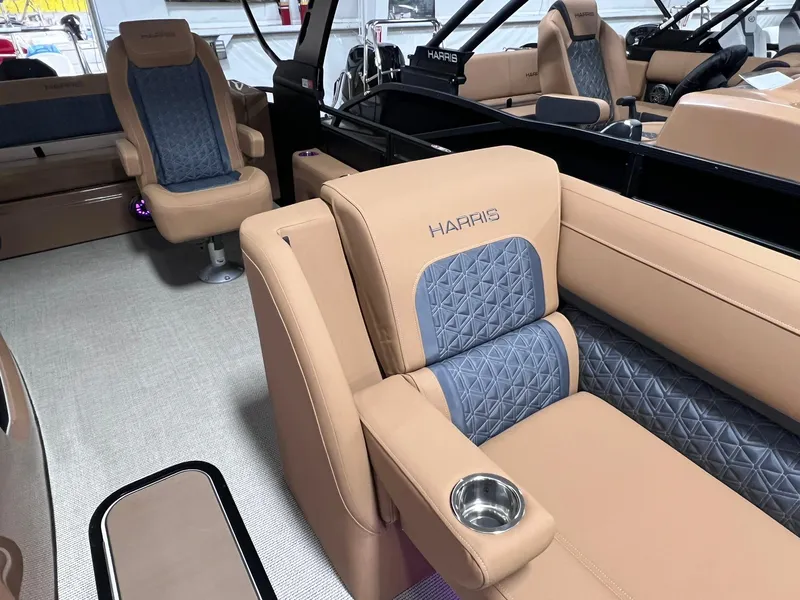 Slide: The Image of Luxurious interior of 2025 Harris Solstice 250 boat with tan and blue seating. - 8