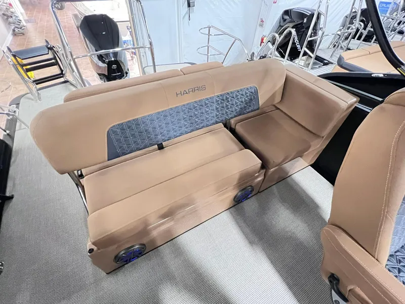 Slide: The Image of 2025 Harris Solstice 250 boat interior with beige seating and modern design. - 9