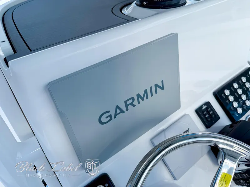 Slide: The Image of 2025 Caymas 281 HB boat dashboard with Garmin navigation system. - 18