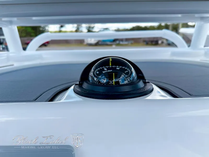 Slide: The Image of Compass on 2025 Caymas 281 HB boat dashboard, showcasing navigation equipment. - 19