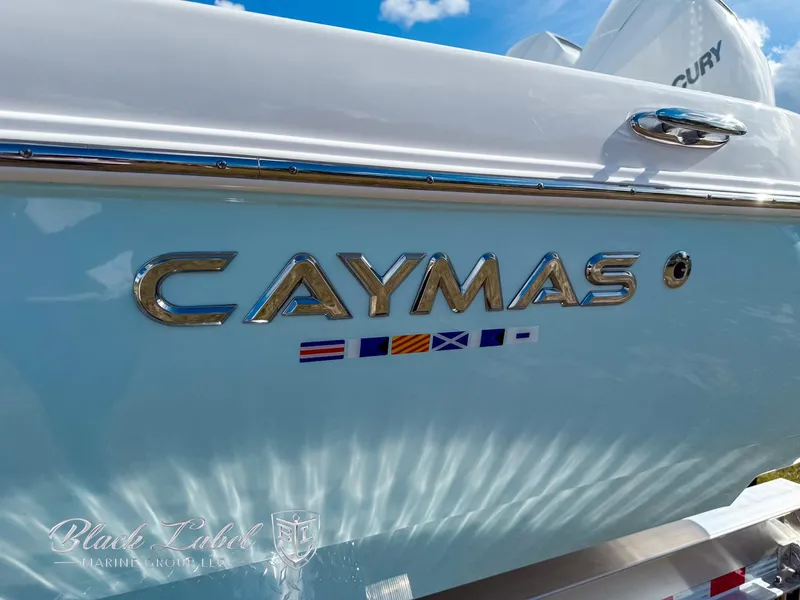 Slide: The Image of 2025 Caymas 281 HB boat with logo and nautical flags on the side. - 3