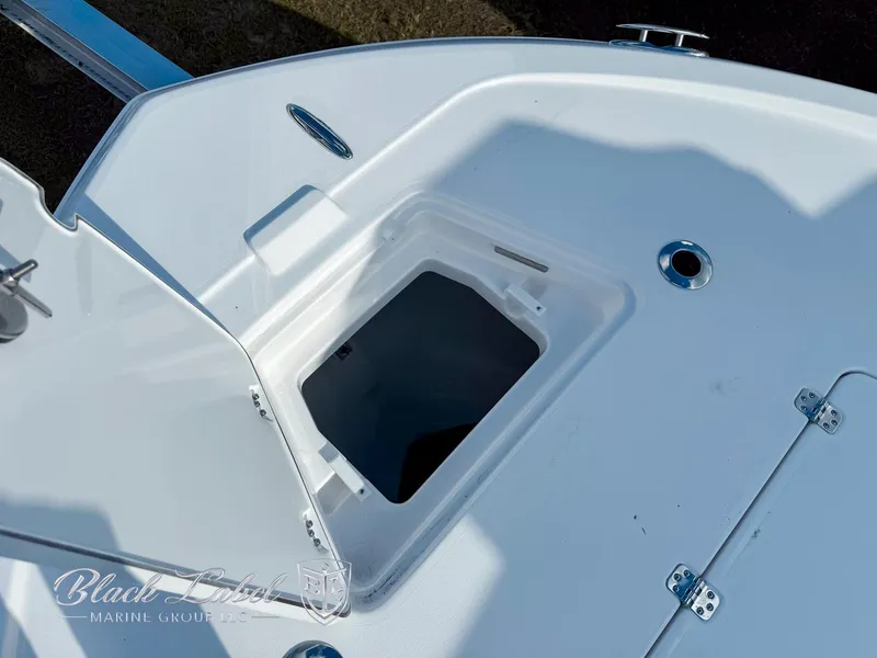 Slide: The Image of 2025 Caymas 281 HB boat storage compartment with open hatch, showcasing sleek design. - 8