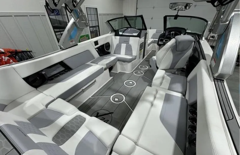 Slide: The Image of 2024 MasterCraft X24 interior seating with gray and white upholstery. - 10
