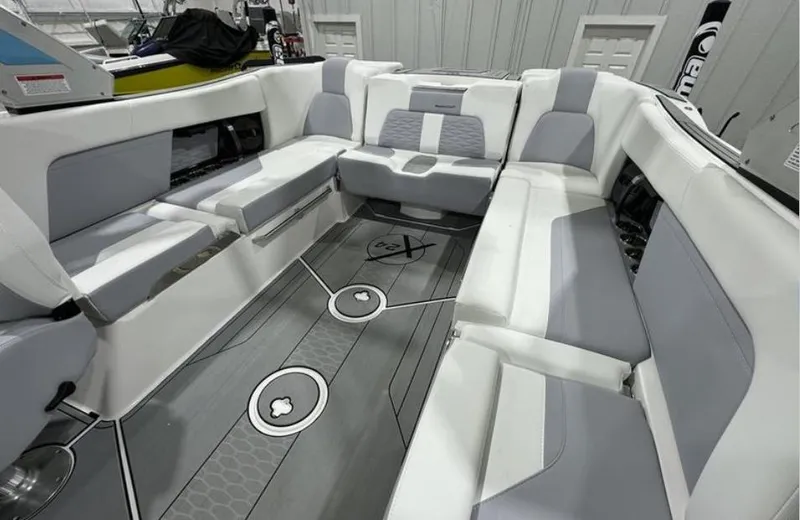 Slide: The Image of 2024 MasterCraft X24 boat interior with sleek seating and modern design. - 12