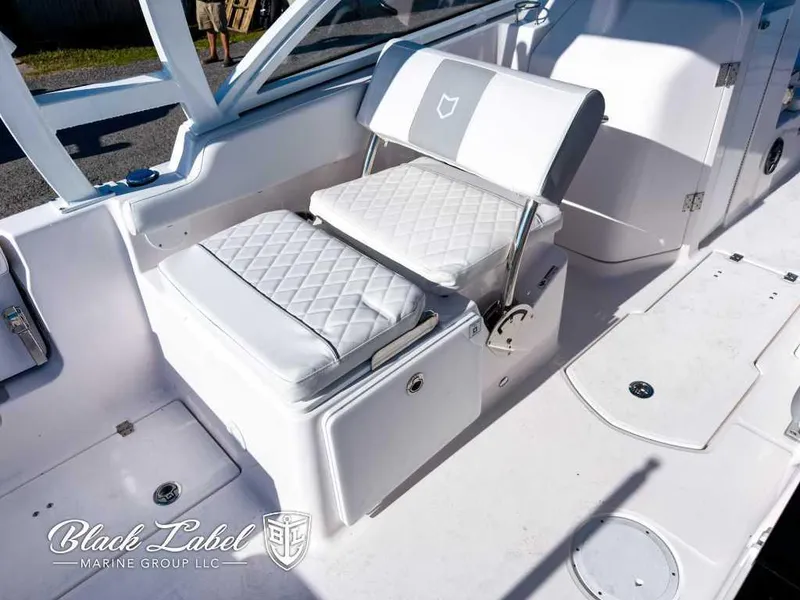 Slide: The Image of 2025 Sea Fox 268 Traveler Dual Console boat interior with white cushioned seating. - 11