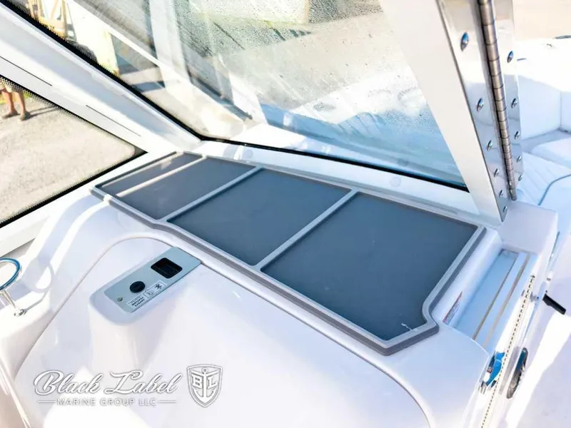 Slide: The Image of 2025 Sea Fox 268 Traveler Dual Console dashboard with windshield and controls. - 13