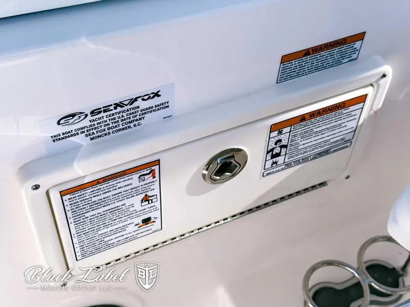 Slide: The Image of Close-up of 2025 Sea Fox 268 Traveler Dual Console warning labels and certification. - 17