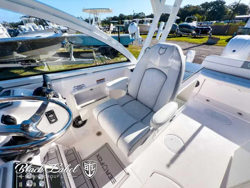 Slide: The Image of 2025 Sea Fox 268 Traveler Dual Console interior with luxurious seating and steering wheel. - 19
