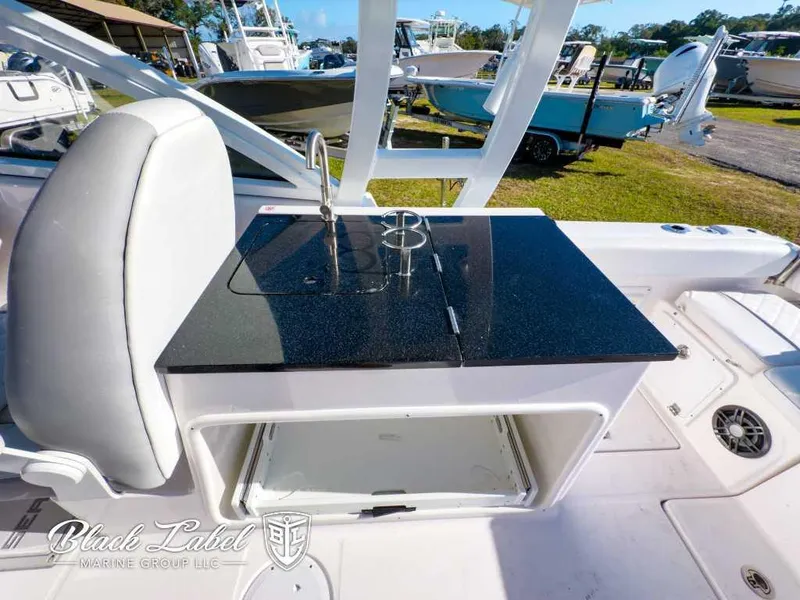 Slide: The Image of Sea Fox 268 Traveler Dual Console 2025 with sleek onboard kitchenette and storage. - 20