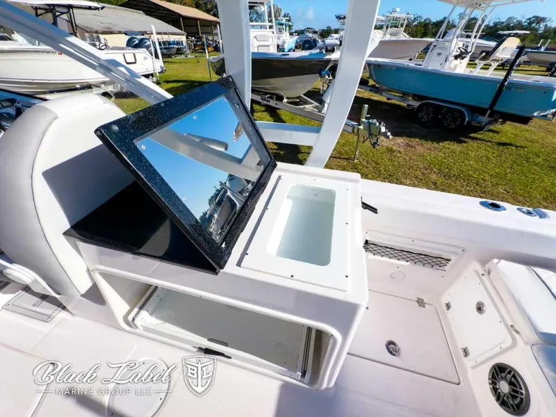 Slide: The Image of 2025 Sea Fox 268 Traveler Dual Console interior with storage and seating. - 21
