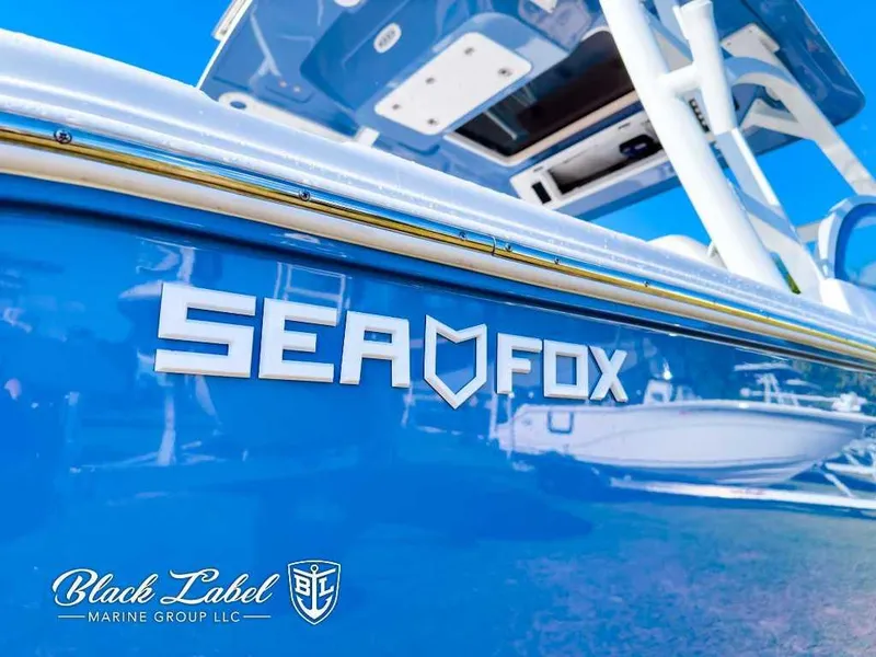 Slide: The Image of 2025 Sea Fox 268 Traveler Dual Console boat, blue hull, Black Label Marine Group logo. - 4