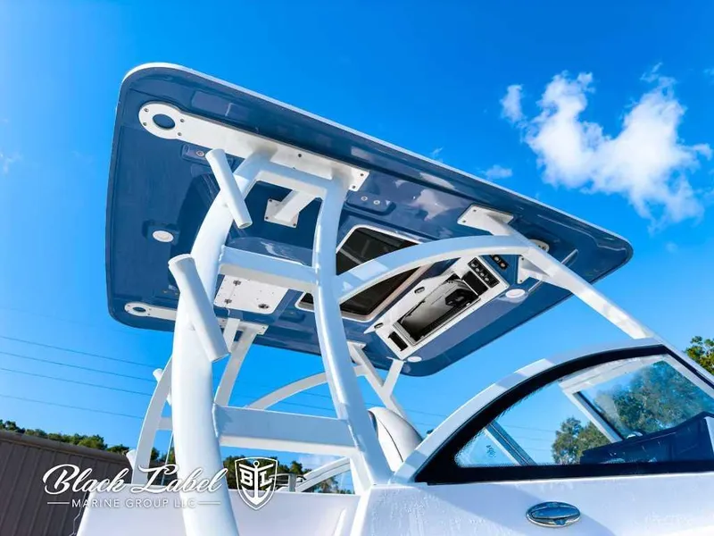 Slide: The Image of 2025 Sea Fox 268 Traveler Dual Console boat with sleek design under clear blue sky. - 5