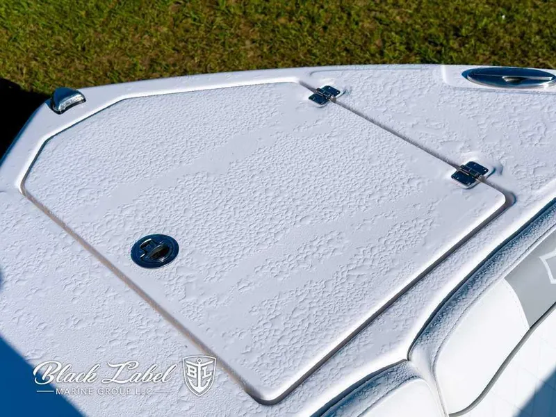 Slide: The Image of 2025 Sea Fox 268 Traveler Dual Console boat deck, featuring textured surface and secure hatch. - 8