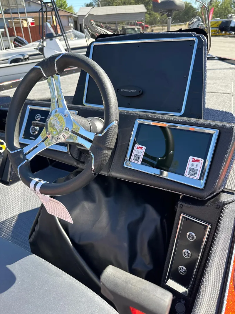 Slide: The Image of 2024 Ranger Z521R boat dashboard with steering wheel and digital displays. - 3