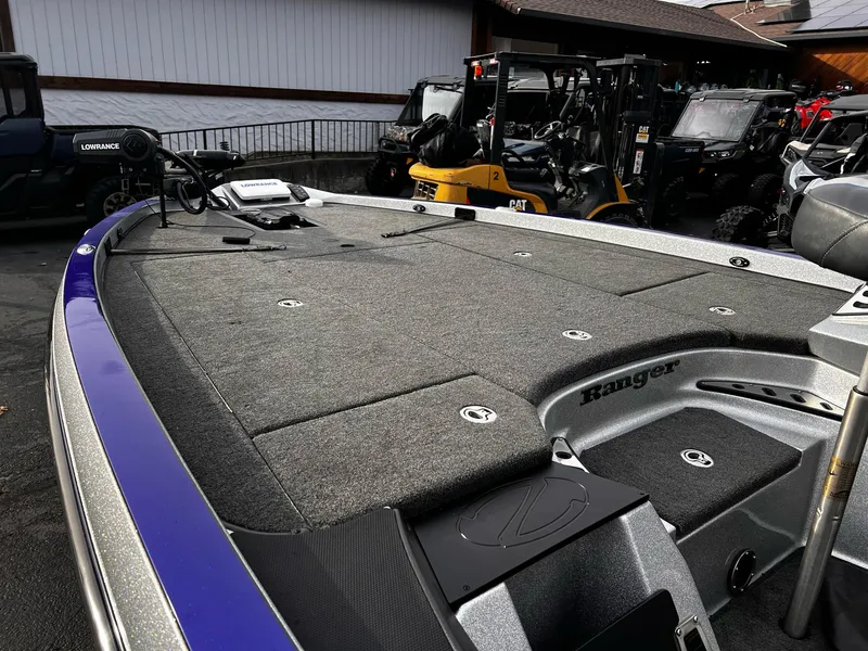 Slide: The Image of 2017 Ranger Z521 Comanche boat deck with storage compartments and trolling motor. - 4