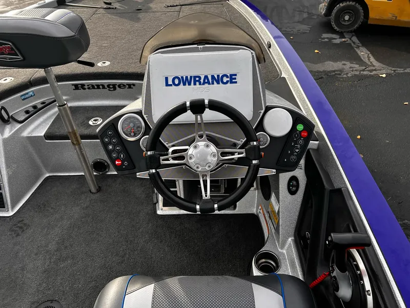 Slide: The Image of 2017 Ranger Z521 Comanche boat dashboard with Lowrance electronics and steering wheel. - 6