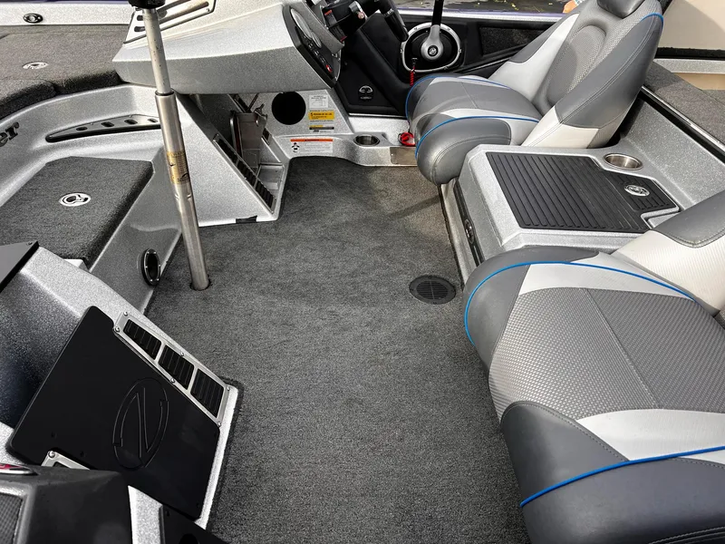 Slide: The Image of 2017 Ranger Z521 Comanche boat interior with gray seating and modern dashboard. - 7