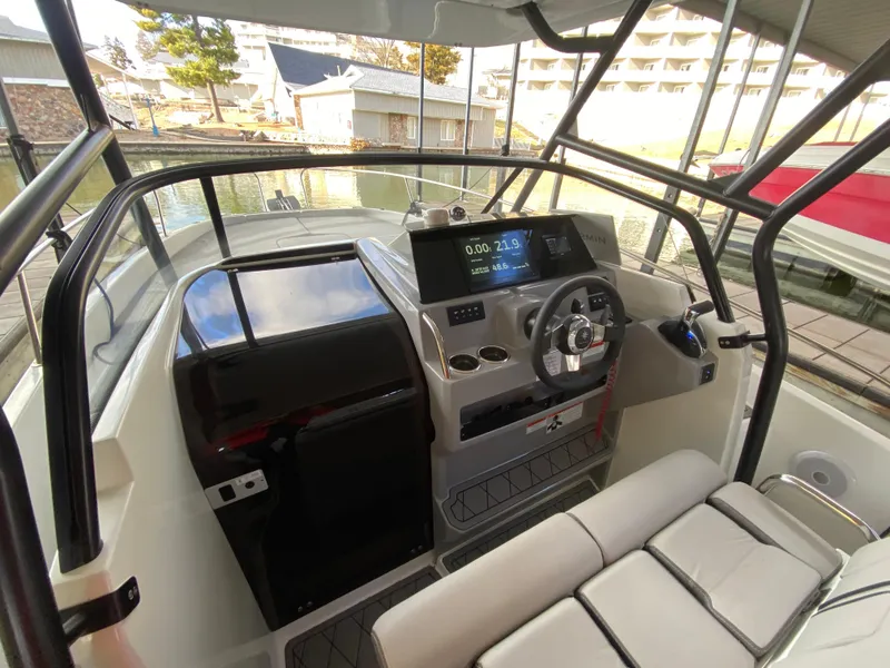 Slide: The Image of 2022 Jeanneau Leader 7.5 boat cockpit with modern dashboard and seating. - 11
