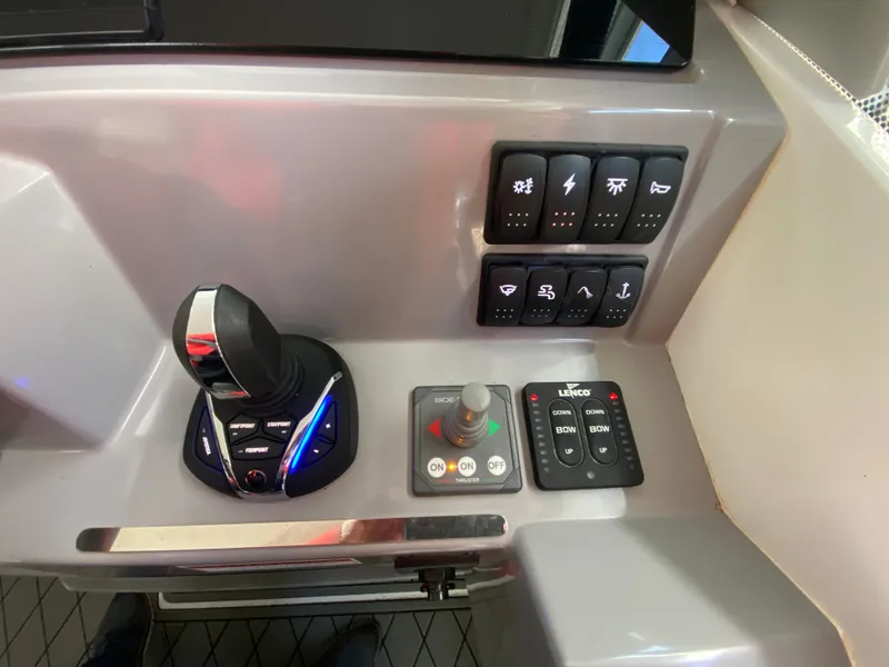 Slide: The Image of Control panel of 2022 Jeanneau Leader 7.5 boat with joystick and switches. - 13