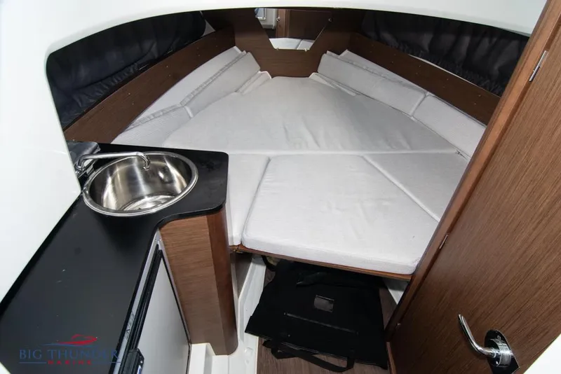 Slide: The Image of 2022 Jeanneau Leader 7.5 cabin interior with bed and sink. - 18