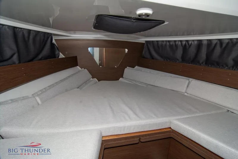 Slide: The Image of Interior cabin of 2022 Jeanneau Leader 7.5 with comfortable seating and modern design. - 20