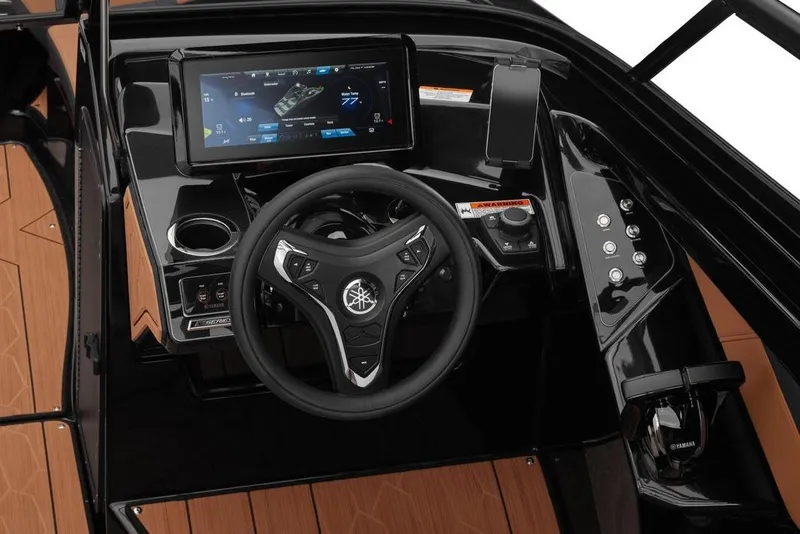 Slide: The Image of 2026 Yamaha Boats 255XD dashboard with touchscreen and steering wheel, featuring modern controls. - 3