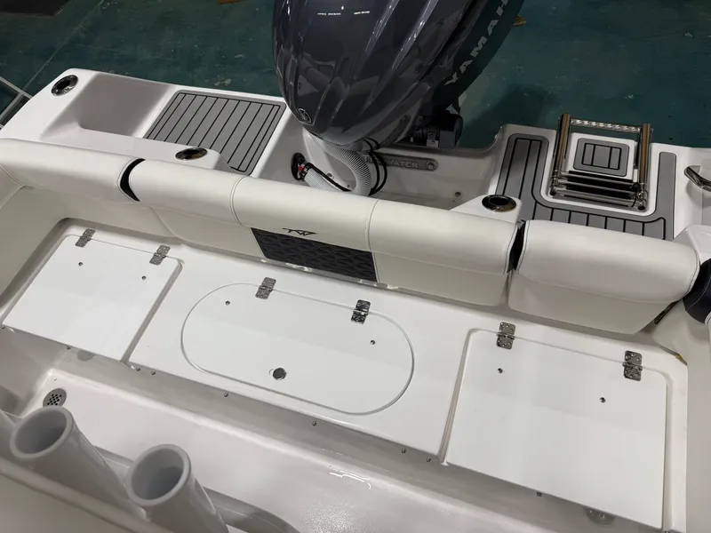 Slide: The Image of 2025 Tidewater 210LXF boat interior with Yamaha engine and seating area. - 16