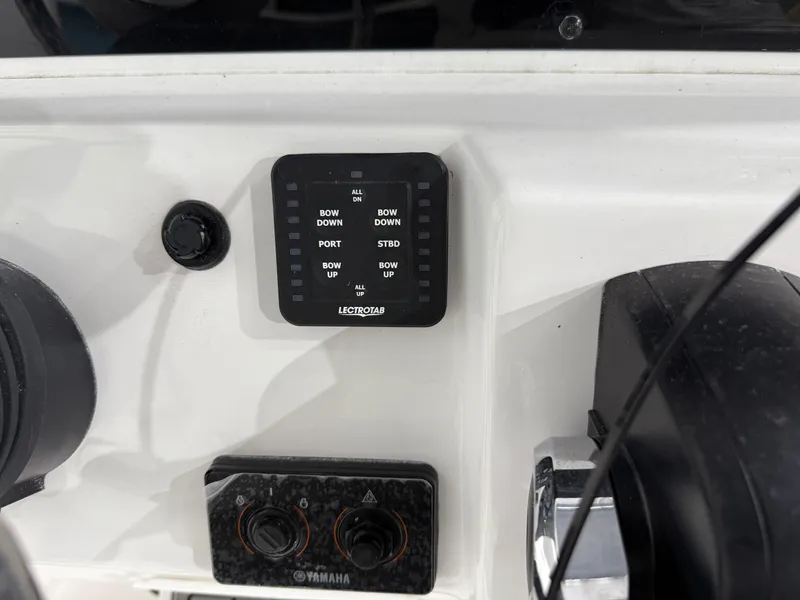 Slide: The Image of Control panel of 2025 Tidewater 210LXF boat with Lectrotab and Yamaha components. - 24