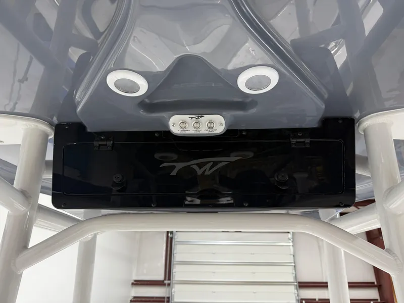 Slide: The Image of 2025 Tidewater 210LXF boat console with speakers and control panel. - 28