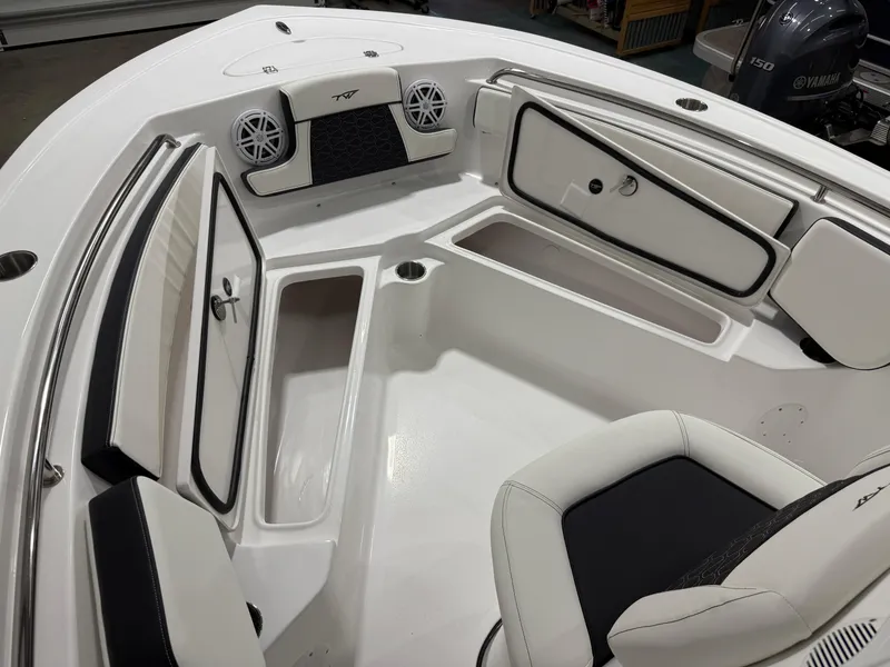 Slide: The Image of 2025 Tidewater 210LXF boat interior with seating and storage compartments. - 34