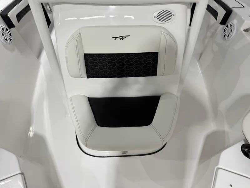 Slide: The Image of 2025 Tidewater 210LXF boat interior with stylish seating and speaker system. - 35