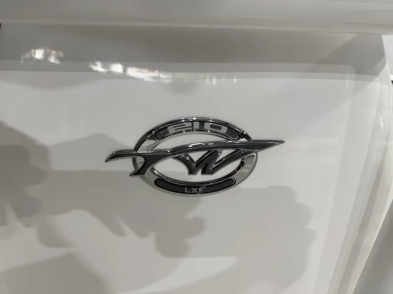 Slide: The Image of 2025 Tidewater 210LXF boat emblem on white surface. - 37