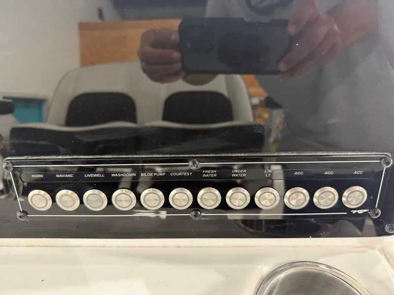 Slide: The Image of Control panel of a 2025 Tidewater 210LXF boat with labeled buttons. - 39