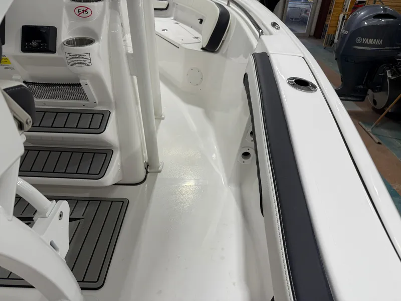 Slide: The Image of 2025 Tidewater 210LXF boat interior with Yamaha engine, featuring sleek seating and modern design. - 40