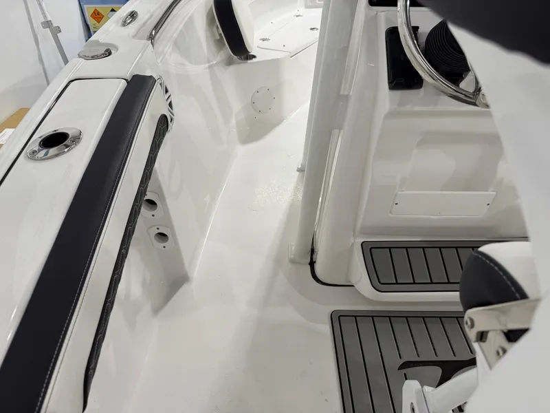 Slide: The Image of 2025 Tidewater 210LXF boat interior with sleek seating and modern steering console. - 41
