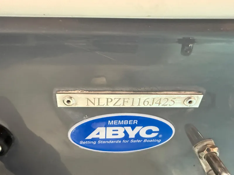 Slide: The Image of Tidewater 210LXF 2025 boat with ABYC member sticker and serial number plate. - 45