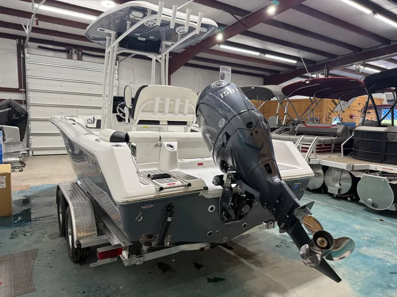 Slide: The Image of 2025 Tidewater 210LXF boat with 150HP engine in a showroom. - 5