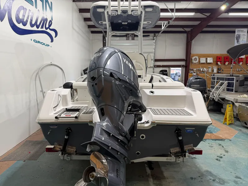 Slide: The Image of 2025 Tidewater 210LXF boat with Yamaha outboard motor in showroom. - 7
